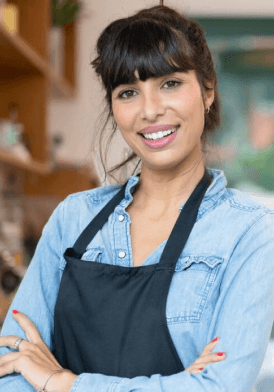 A smiling chef with a mischievous grin