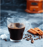 A delicious cup of coffee beans in a bustling coffee shop