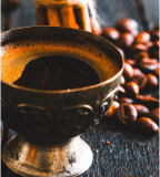 A delicious cup of coffee beans in a bustling coffee shop